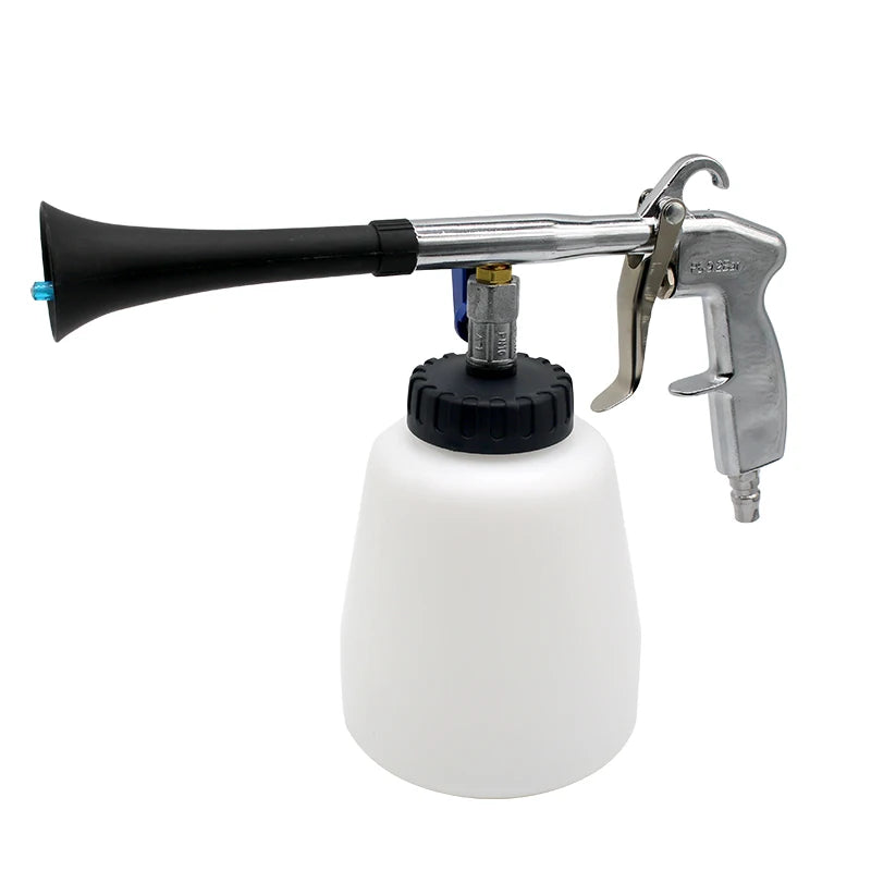 Pneumatic tornado detail cleaning gun with chrome trigger handle and white fluid bottle on a white background