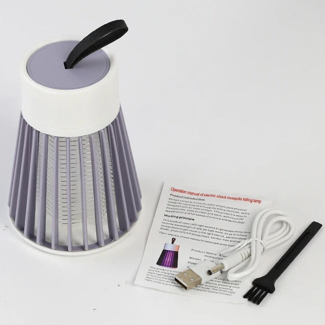 Cordless Insect Zapper with USB charging cable, cleaning brush and instruction manual on a white background