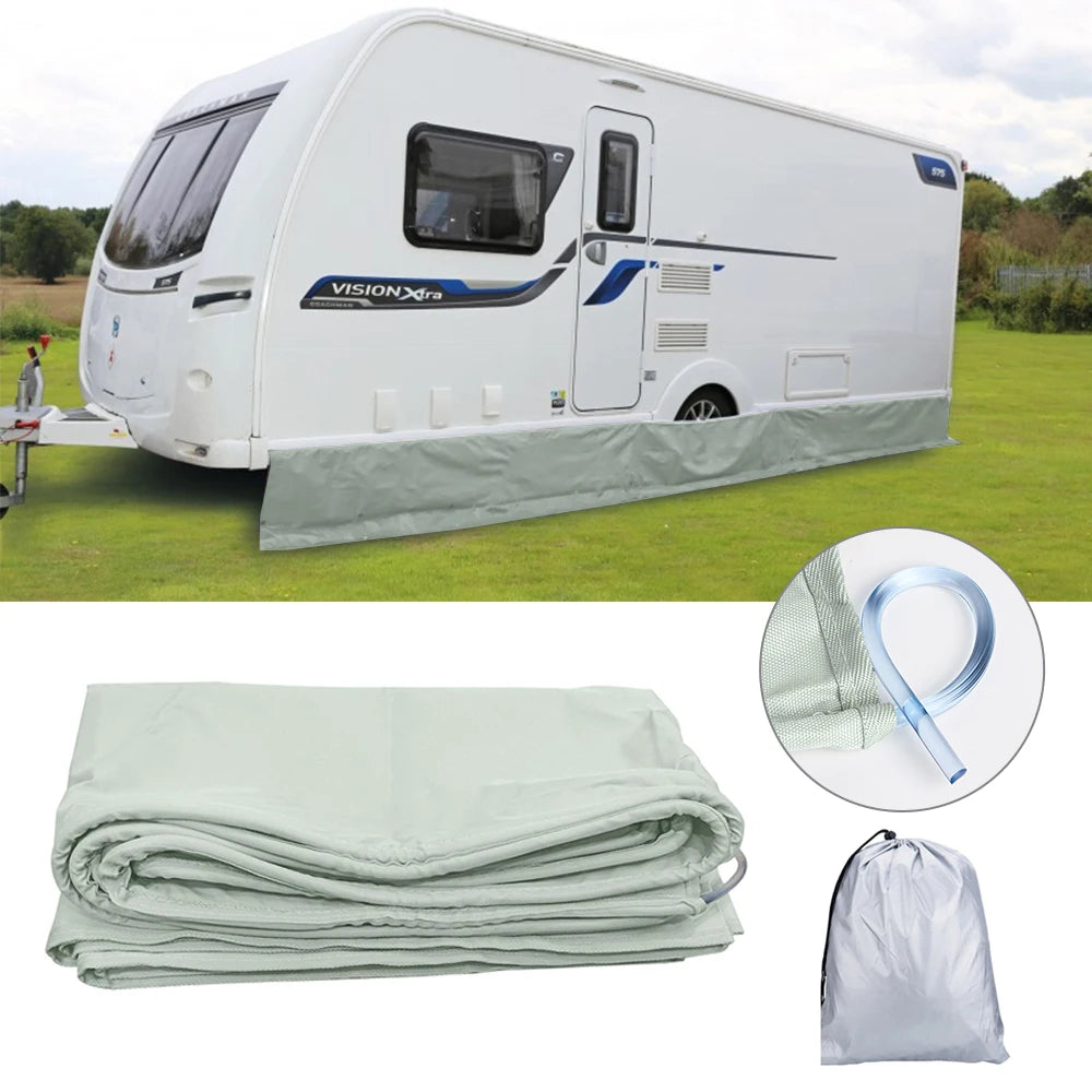 Caravan Awning Draught Skirt in grey fitted along a white caravan's lower edge, with the folded skirt, mounting strip and storage bag below