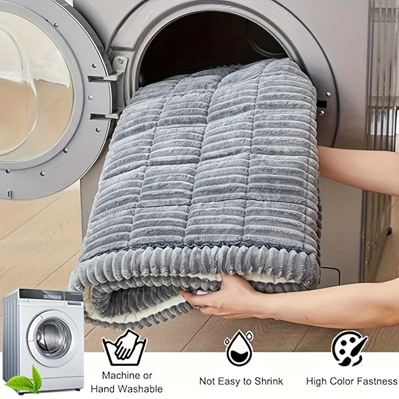 Grey Plush Pet Car Cushion being loaded into a washing machine, showing it is machine washable, shrink-resistant and colourfast