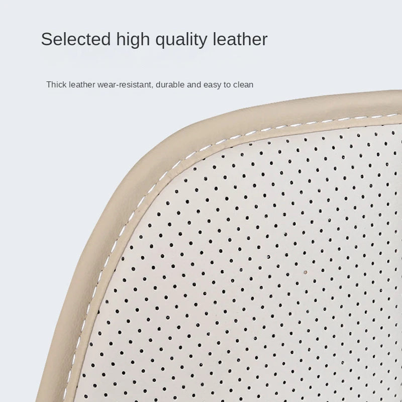 Close-up of the ISOFIX Child Seat Protector's perforated cream leather surface and stitched edge