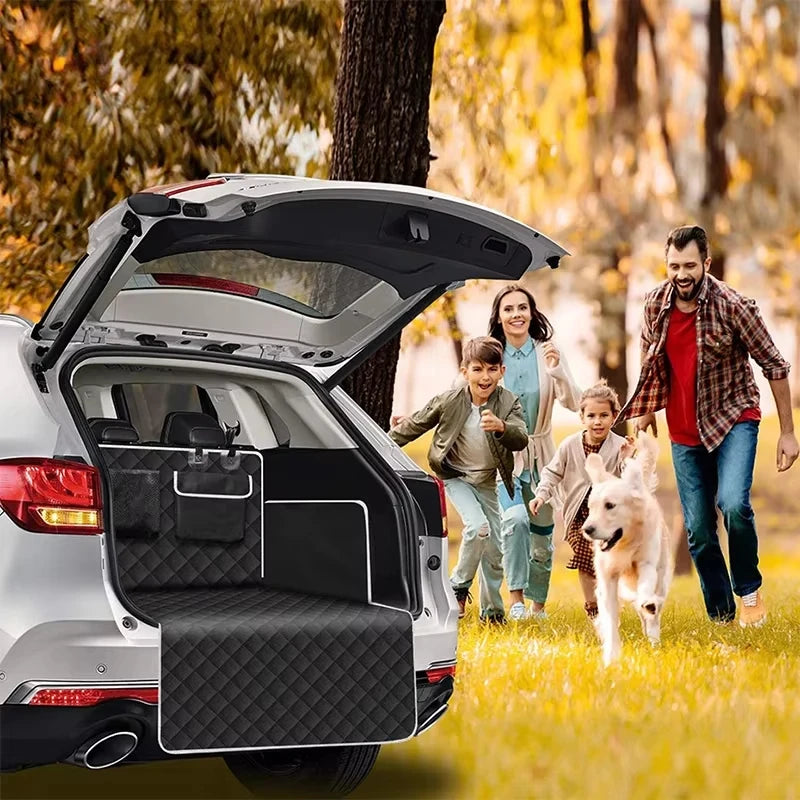 Waterproof Dog Car Boot Liner fitted in an SUV boot with a family and their Golden Retriever running across a grassy park