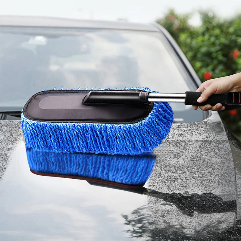Telescopic Car Wax Mop Kit being used to dust a car's windscreen outdoors