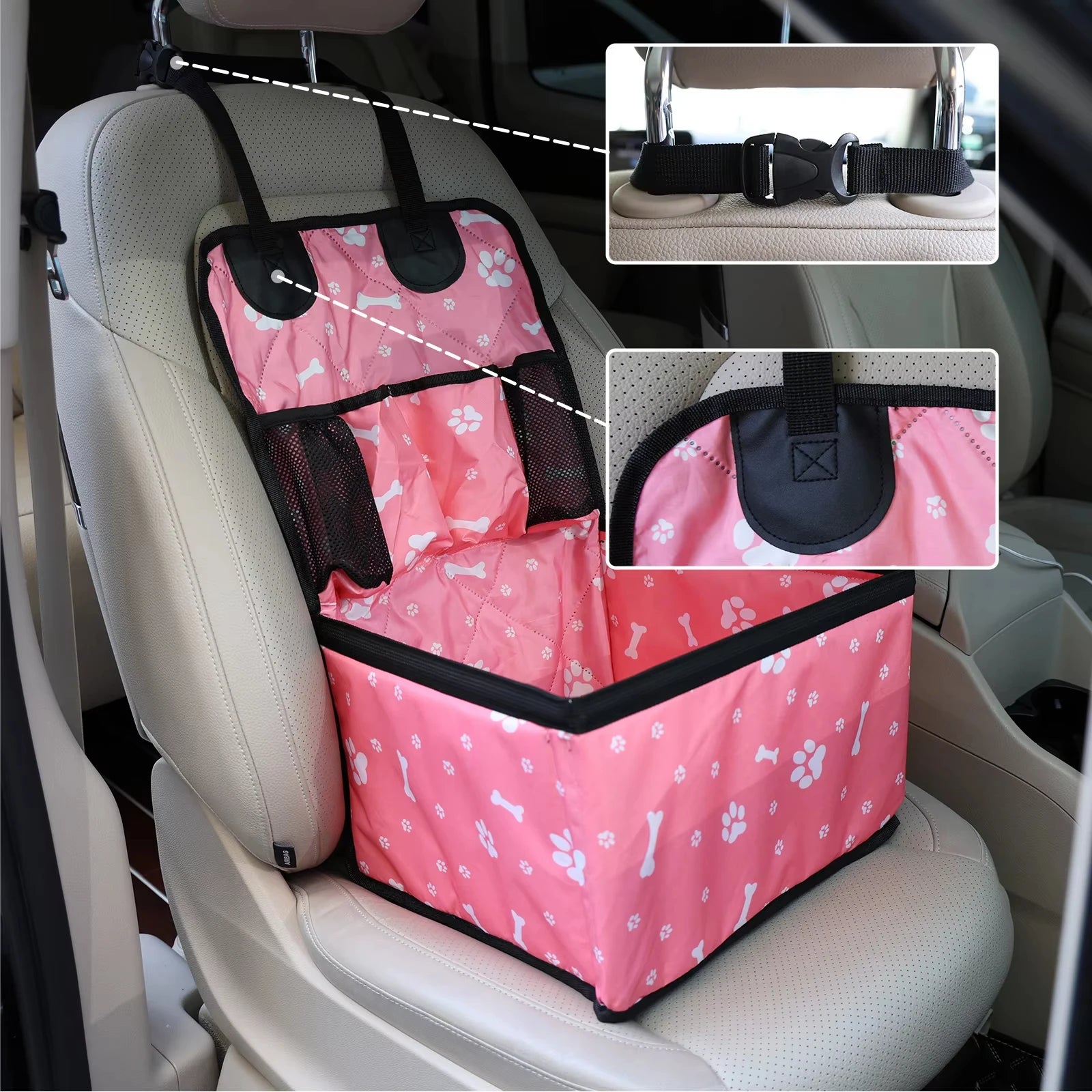 Pink paw print dog car booster seat installed on a car seat with headrest strap and hook detail insets