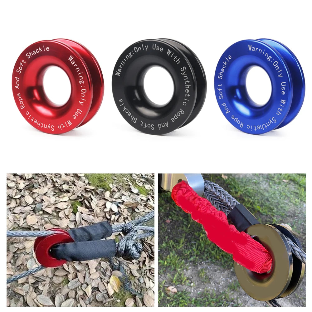 Red, black and blue anodised aluminium recovery rings for soft shackles with warning text engraved on each ring