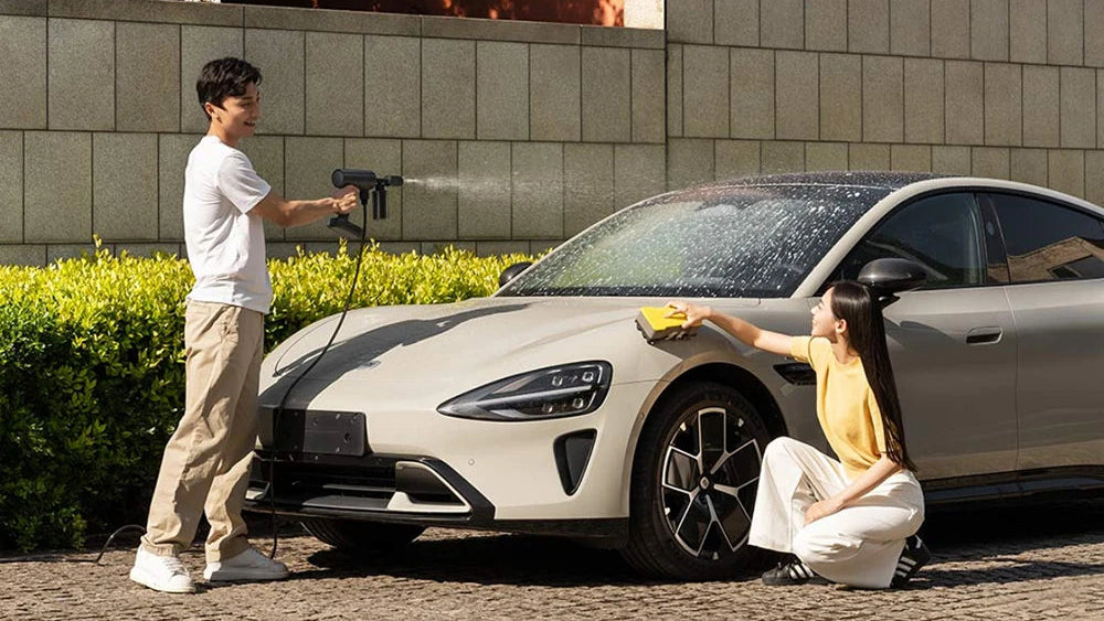 Two people washing a car with text about wireless car wash system.