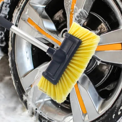 Ultra-Soft Detailing Brush scrubbing a sudsy alloy wheel and cleaning a car windscreen