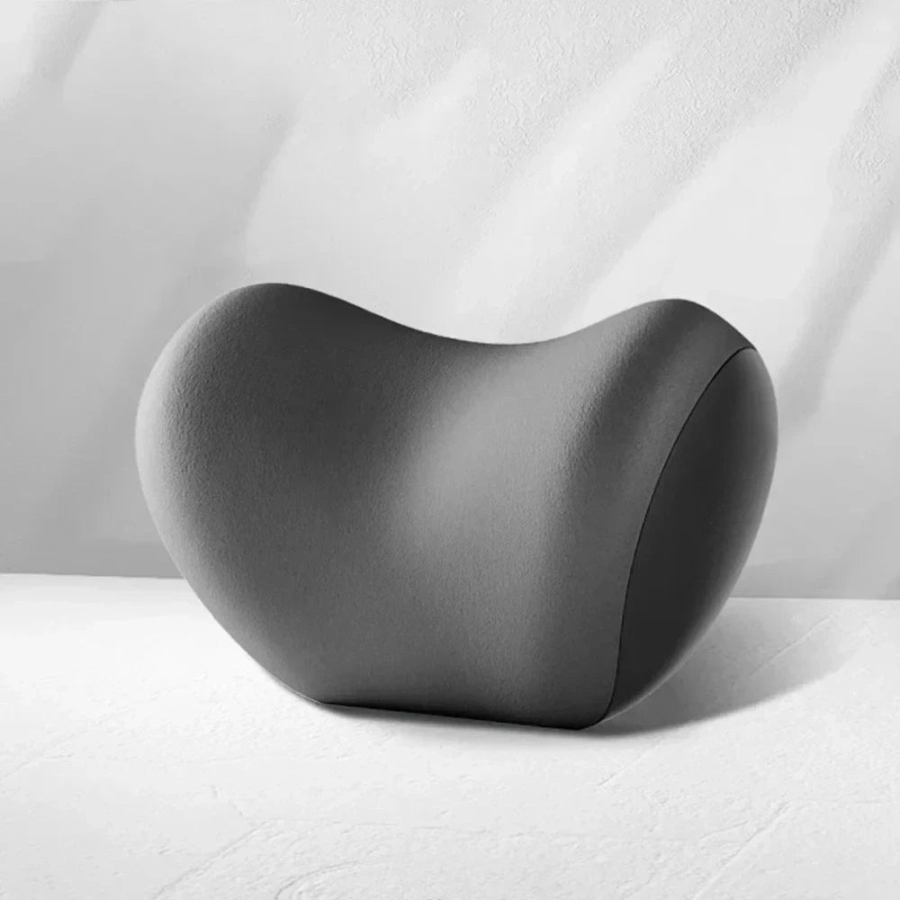 Close-up studio shot of the Memory Foam Car Headrest Neck Pillow showing its contoured ergonomic shape