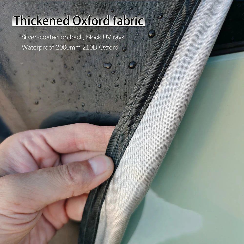 Close-up of the Overland Tailgate Tent's thickened, silver-coated waterproof Oxford fabric repelling water droplets