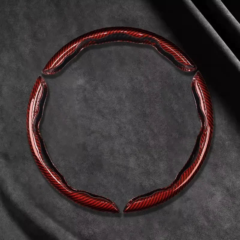 Red Carbon Fibre Wheel Cover unclipped ring on dark background