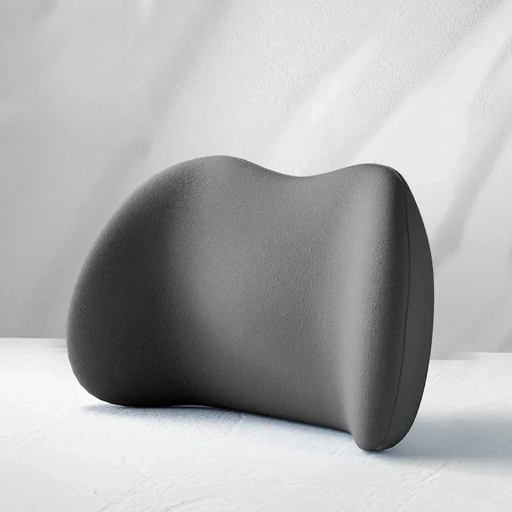 Memory Foam Lumbar Support Cushion in dark grey memory foam shown from a side angle on a light studio backdrop