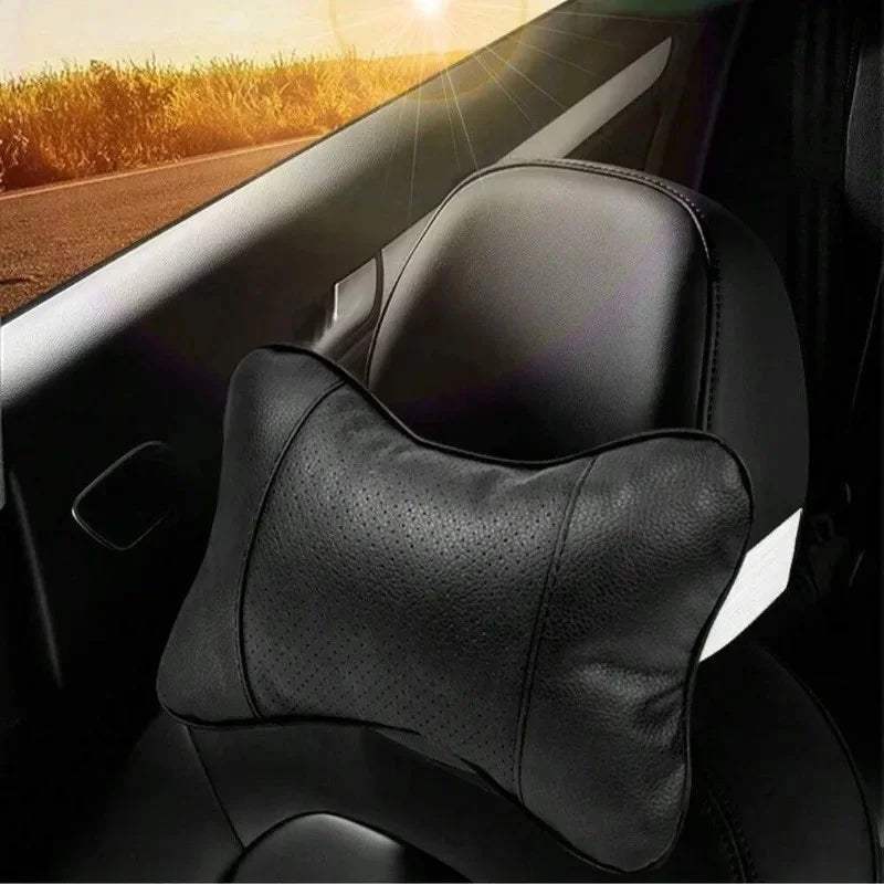 Car neck support cushion on headrest against a golden sunset driving scene