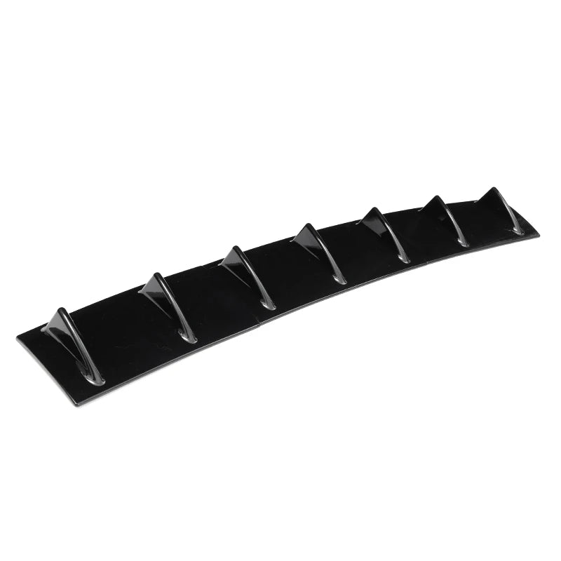 Gloss black ABS shark fin rear diffuser with seven fin blades photographed at an angle on a plain white background