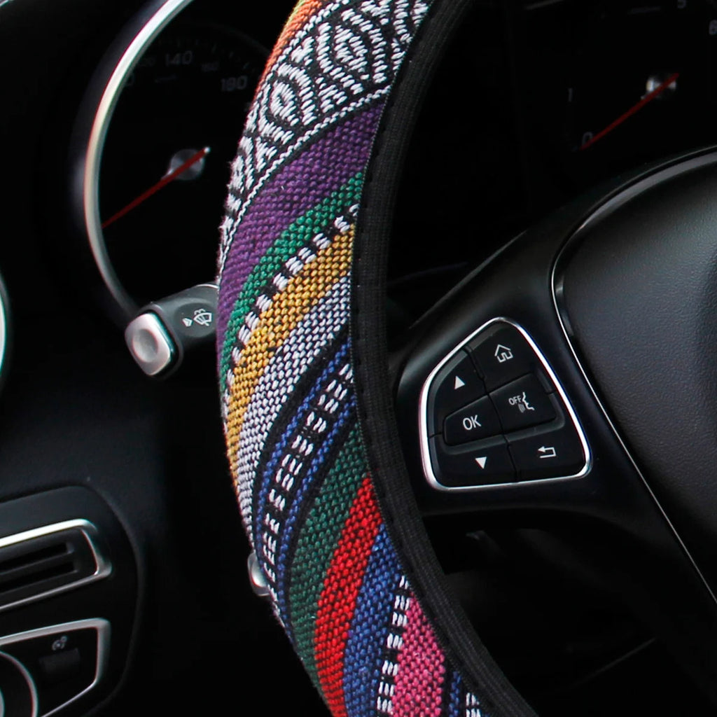 Close-up of the multicolour striped weave on the bohemian linen steering wheel cover fitted to a steering wheel