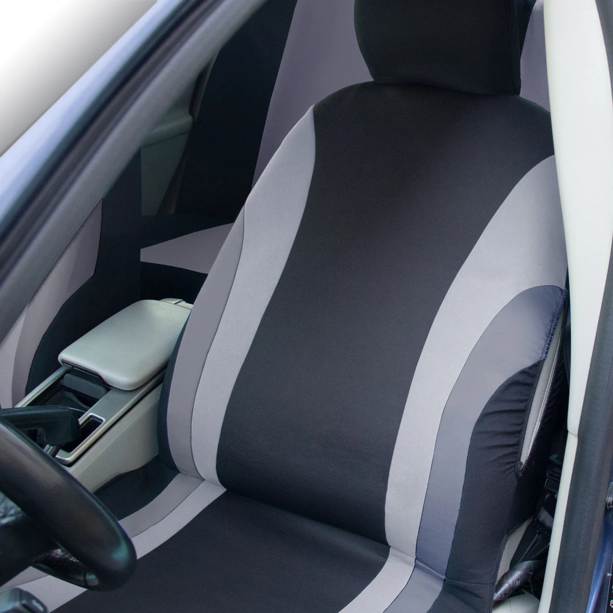 Car seat with black and gray patterned cover inside a vehicle