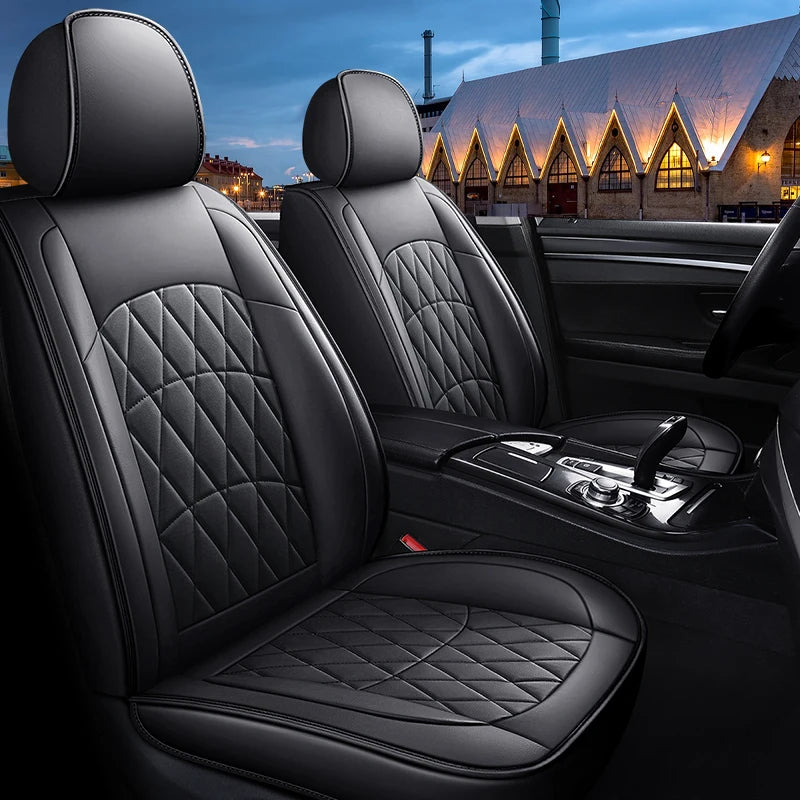 Close-up of a Full Coverage PU Leather Car Seat Cover on a front seat with city lights at night
