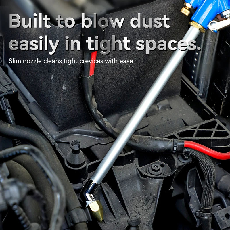 Pneumatic detailing air gun with slim nozzle blowing dust out of a car engine bay in a tight space