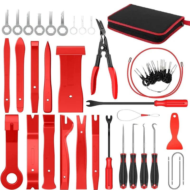 Red interior trim removal tool kit and panel clip door card pry bar set arranged in rows next to its zippered carry case.