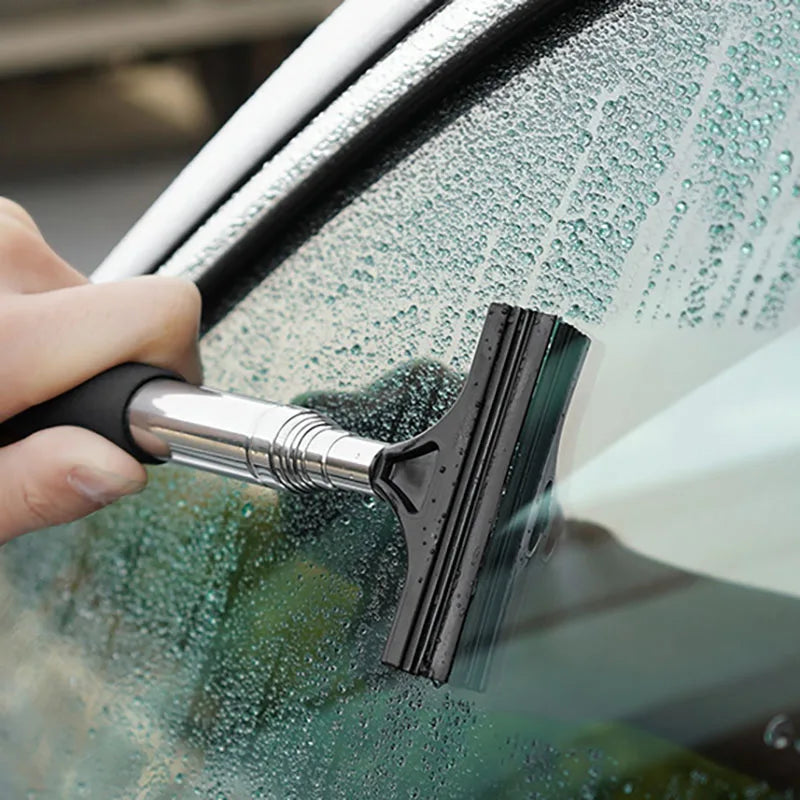 Retractable Auto Glass Squeegee wiping condensation from a car windscreen with foam-grip handle