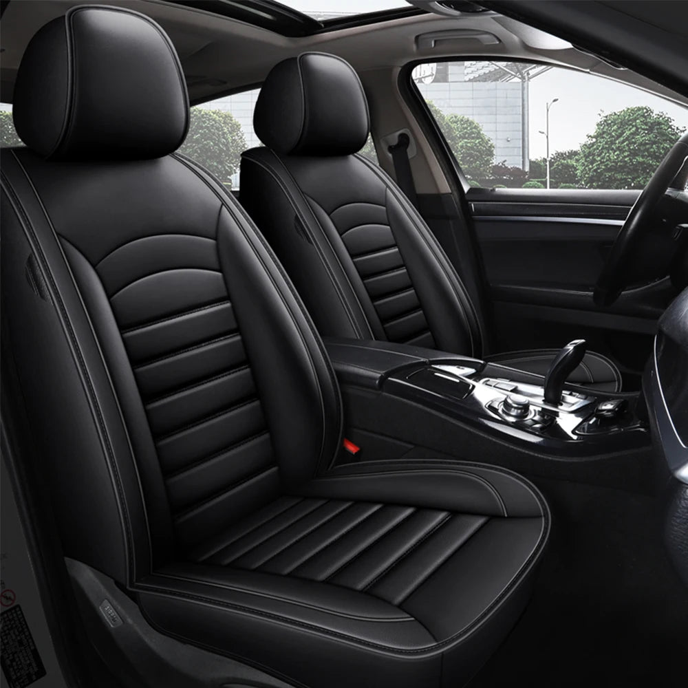 Black Leather Car Seat Cover installed on car front seats with ribbed diamond stitched backrest viewed through open door