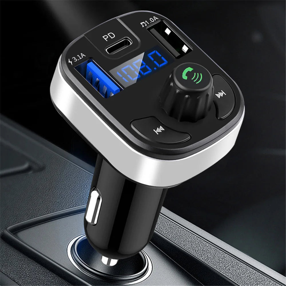 Triple-Port Bluetooth FM Transmitter plugged into a car 12V socket showing the blue LED frequency display