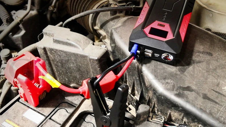 Car jump starter device connected to a car battery