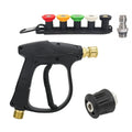 Pressure washer spray gun with five colour-coded quick-connect nozzles, a garden hose thread adapter and a stainless quick-connect fitting laid out on a white background