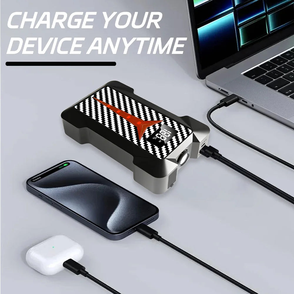 4-in-1 Roadside Power Pack charging a smartphone and wireless earbuds by cable next to a laptop