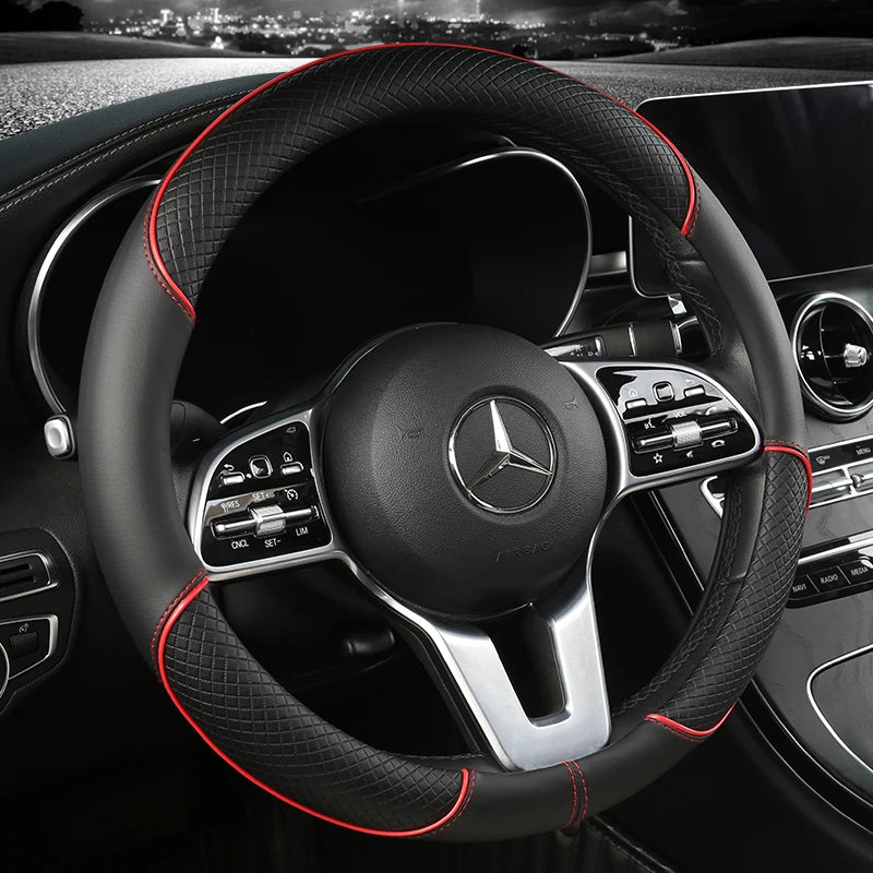 Diamond Leather Steering Wheel Cover with red stitching installed on a car steering wheel, night cityscape background
