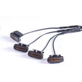 Four Smoked Amber Grille Lights with smoked lenses and wiring harness on a white background