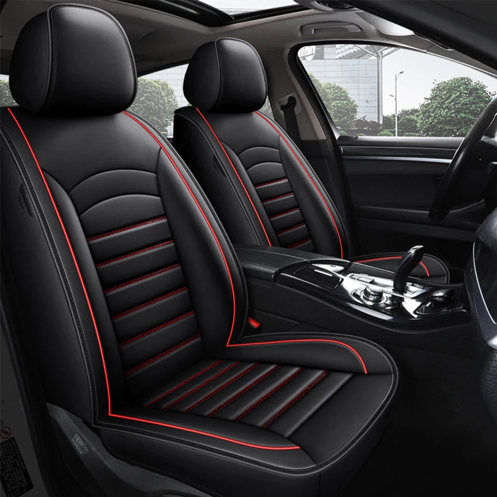 Black Leather Car Seat Cover with red piping trim installed on car front seats viewed through open door