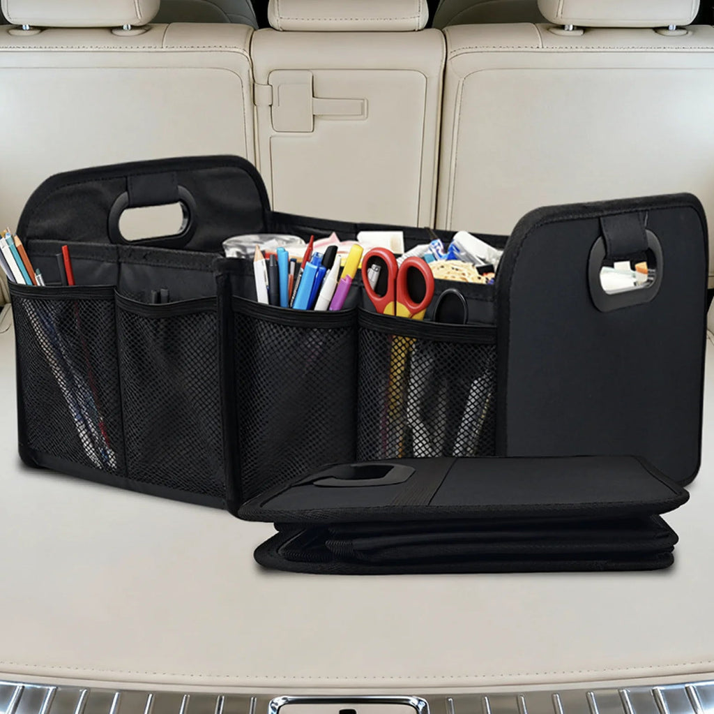 Foldable Car Boot Organiser filled with stationery and craft supplies in mesh side pockets inside a car boot