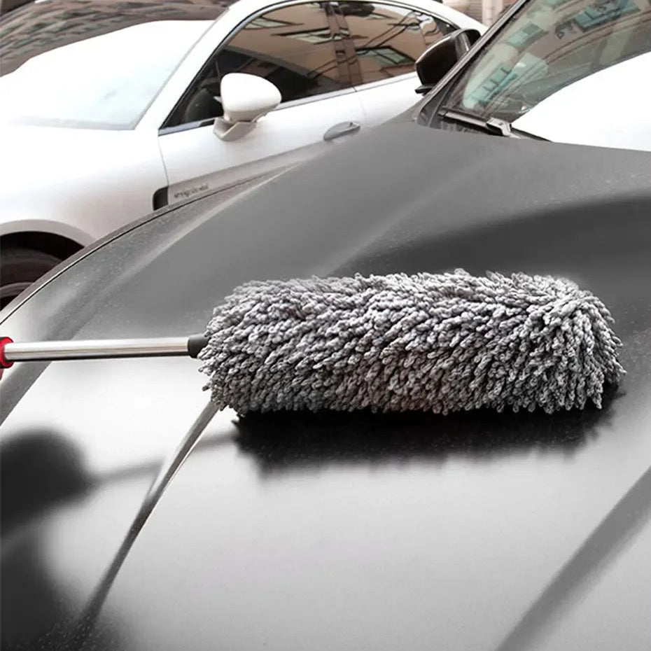 Twin Microfibre Detail Duster grey microfibre head dusting the bonnet of a dark grey car
