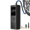 Pocket 150 PSI Tyre Inflator in black with digital pressure display, braided air hose attached to a car tyre valve and four nozzle adapters
