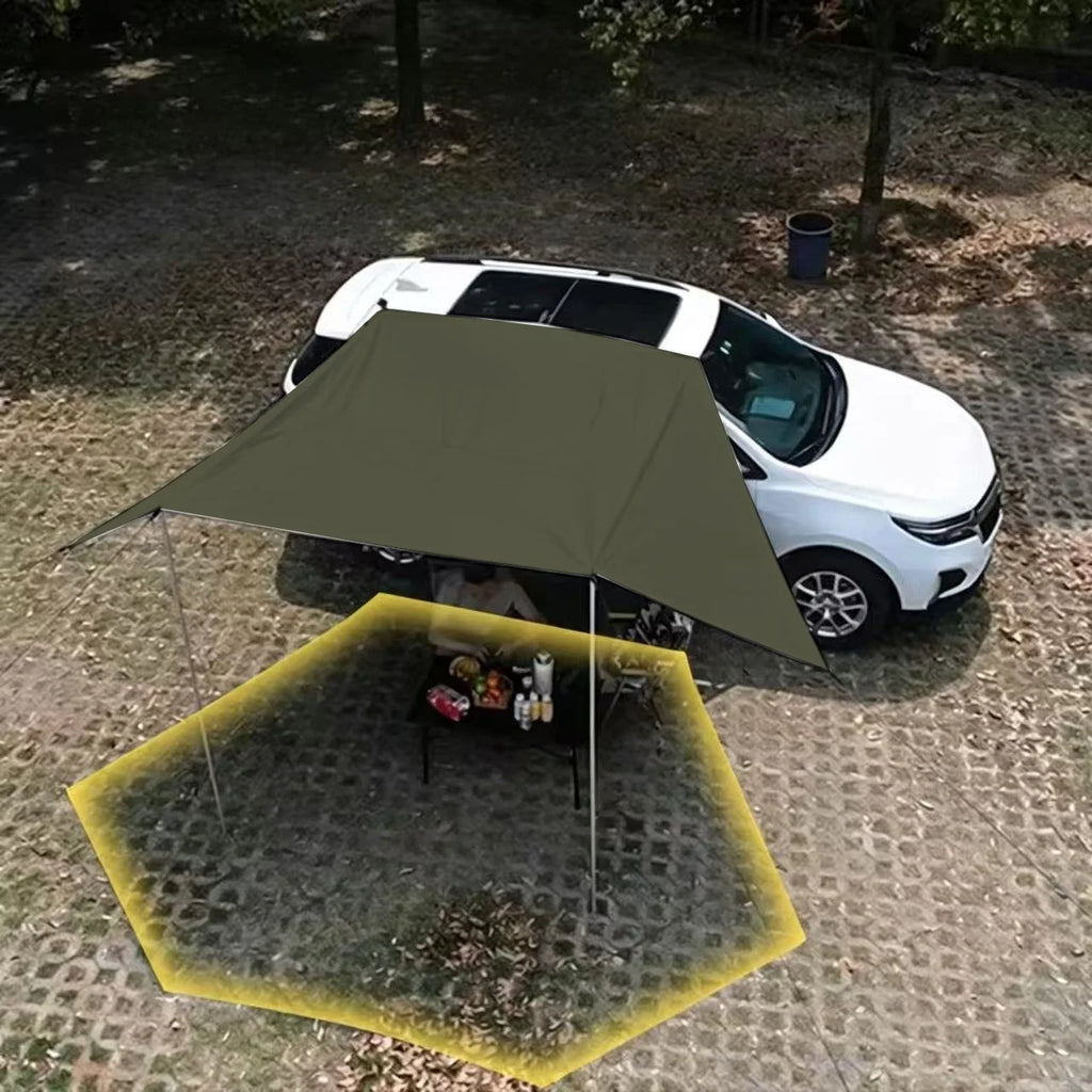 Aerial view of the Expedition Side Sunshade deployed beside a white SUV in a forest, highlighting the shaded camping area