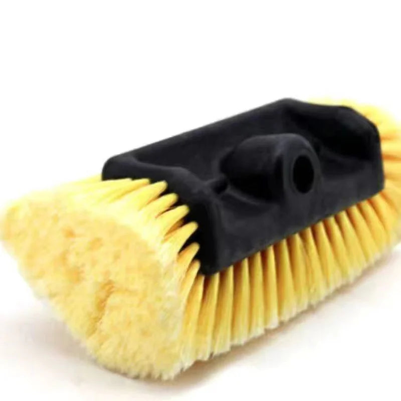 Close-up of the Telescopic Wash Brush's soft bristle head and swivel connector on a white background