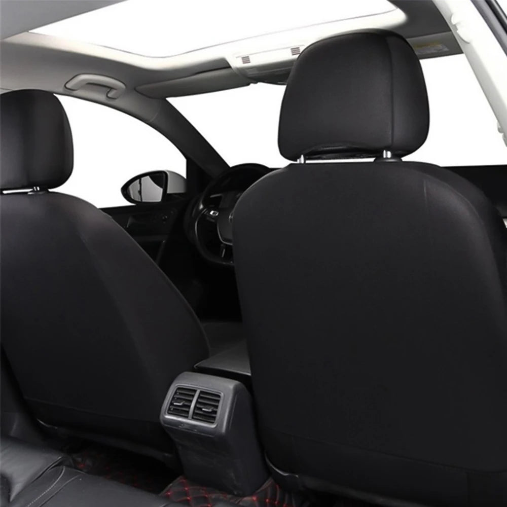 Universal Seat Cover Set black leather front seats installed in car viewed through open sunroof with door and dashboard visible
