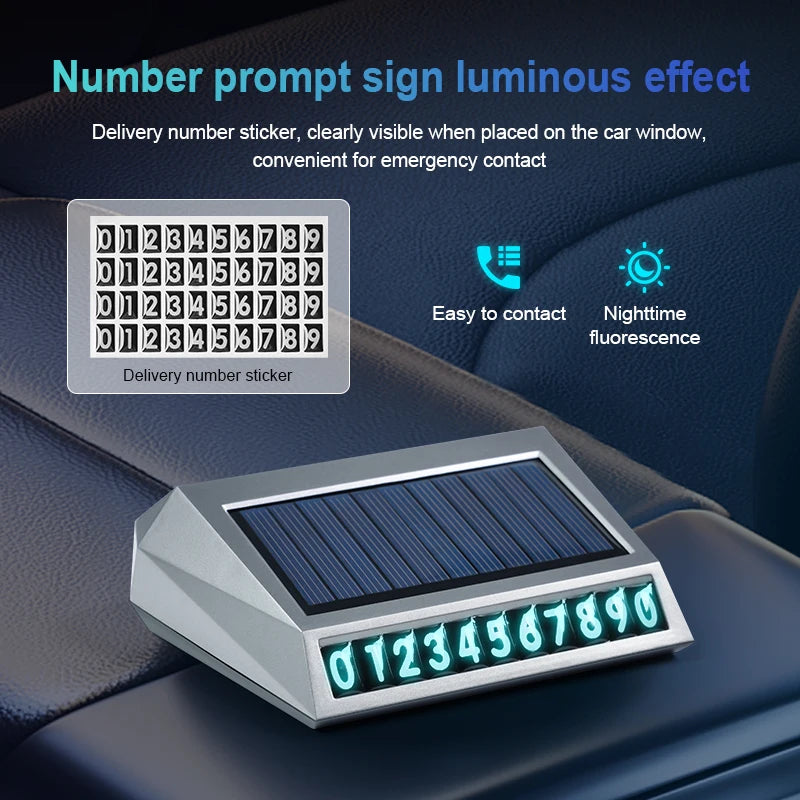 Solar car air purifier on a dashboard displaying a glowing emergency contact number sticker