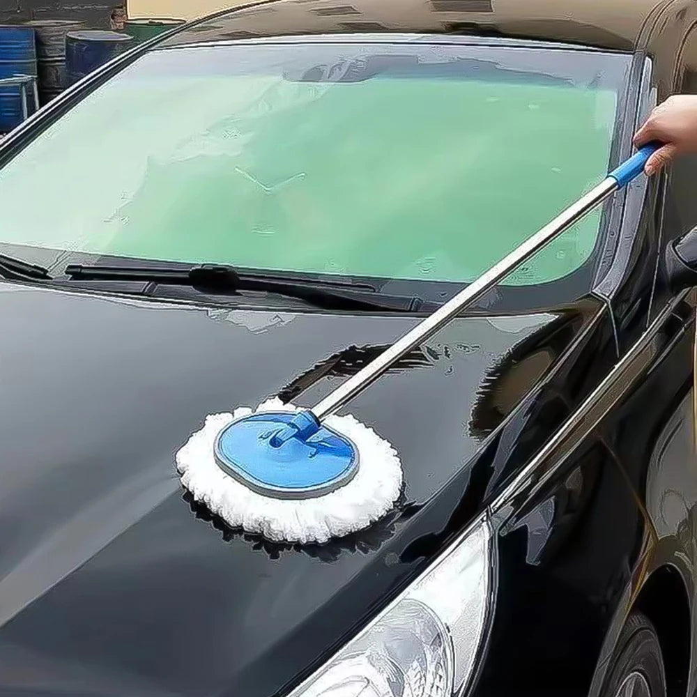 Rotating car wash brush being used to clean the bonnet and windscreen of a black car