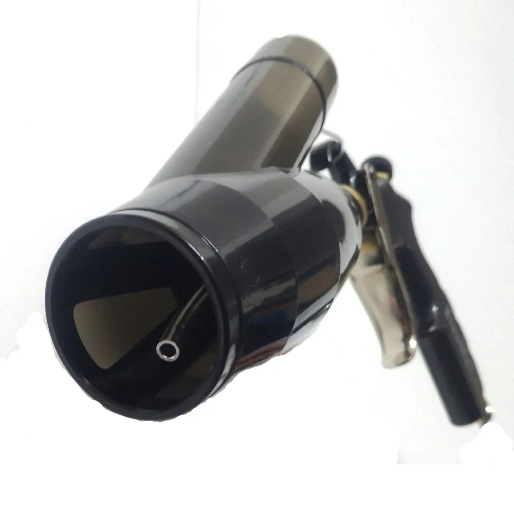 Close-up of the air detailing gun's nozzle head and metal trigger