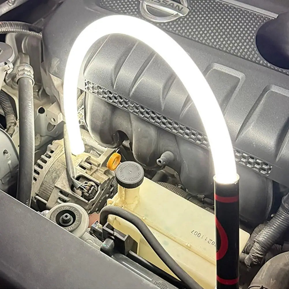 Flexible LED Work Light bent and hooked around a car engine component for hands-free lighting