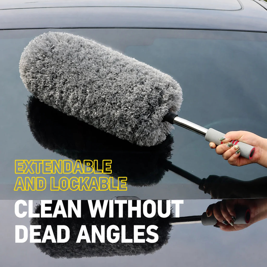 Telescopic Microfibre Car Duster extended and held to dust a dark car windscreen