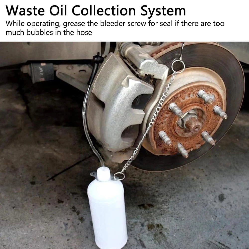 Vacuum Brake Bleeder waste oil collection bottle attached to a car's brake caliper bleeder screw