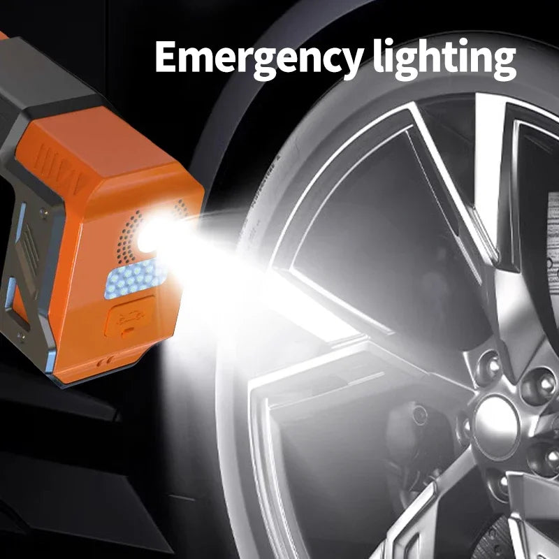 5000A Jump Starter & Inflator emergency LED light shining on a car wheel at night