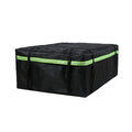 Black waterproof roof cargo bag with reflective green stripe shown from a front angled view on a white background