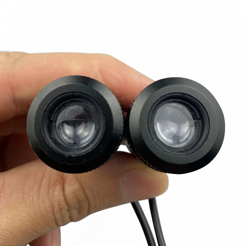 LED Door Welcome Lights lens close-up held in hand showing projector detail