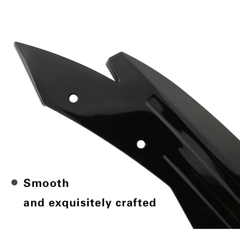 Close-up of a glossy black rear bumper corner guard showing smooth moulded finish and mounting holes