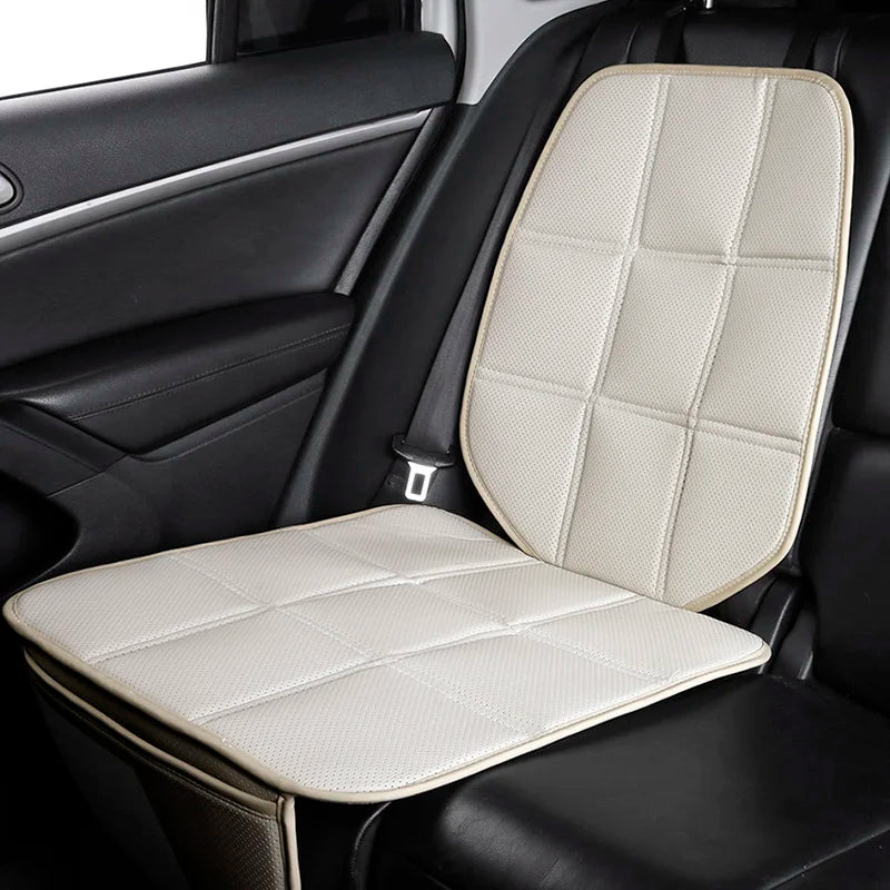 ISOFIX Child Seat Protector in cream fitted beneath a child car seat on a vehicle's rear seat