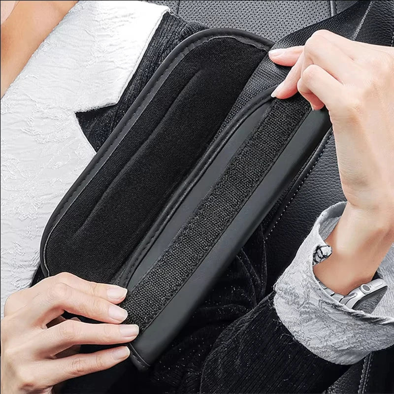 Hands Fastening Velcro Strap on Leather Seat Belt Shoulder Pad