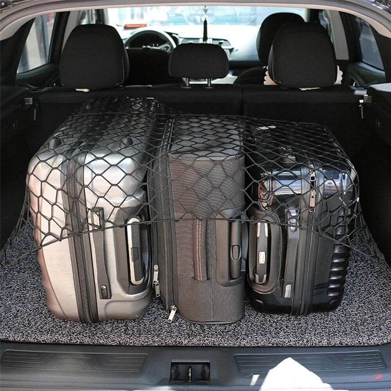 Heavy-Duty Boot Cargo Net securing three suitcases upright in a car boot for tidy luggage storage